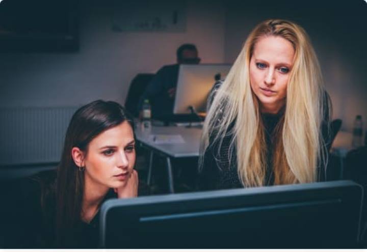 Commercial Finance | Two women at a computer